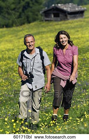 mature couple walking in the mountains View Large Photo Image Stock Image - mature couple walking in the mountains. Fotosearch