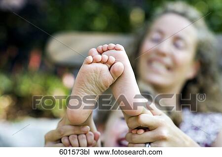 mother playing with her child´s feet View Large Photo Image Stock Image - mother playing with her child´s feet. Fotosearch