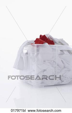 pile of white laundry with one red sock in basket View Large Photo Image Stock Image - pile of white laundry with one red sock in basket. Fotosearch