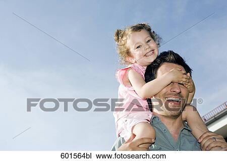 portrait of father carrying little girl on his shoulders View Large Photo Image Stock Image - portrait of father carrying little girl on his shoulders. Fotosearch