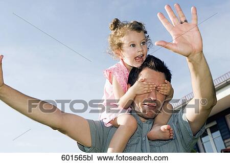 portrait of father carrying little girl on his shoulders View Large Photo Image Stock Image - portrait of father carrying little girl on his shoulders. Fotosearch