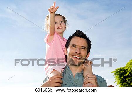 portrait of father carrying little girl on his shoulders View Large Photo Image Stock Image - portrait of father carrying little girl on his shoulders. Fotosearch