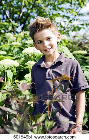 portrait of little boy in garden View Large Photo Image Stock Image - portrait of little boy in garden. Fotosearch