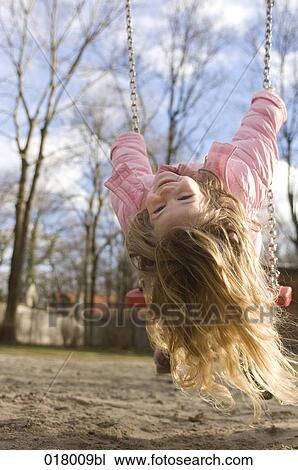 portrait of little girl playing on swing View Large Photo Image Stock Image - portrait of little girl playing on swing. Fotosearch