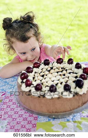 portrait of little girl stealing cherry from cake View Large Photo Image Stock Image - portrait of little girl stealing cherry from cake. Fotosearch