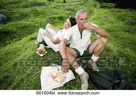 portrait of mature couple having picnic in the mountains View Large Photo Image Stock Image - portrait of mature couple having picnic in the mountains. Fotosearch