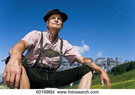 portrait of mature man wearing hat and lederhosen in the mountains View Large Photo Image Stock Image - portrait of mature man wearing hat and lederhosen in the mountains. Fotosearch
