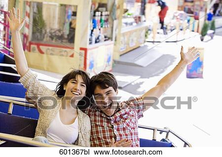 portrait of teenage couple at merry-go-round View Large Photo Image Stock Image - portrait of teenage couple at merry-go-round. Fotosearch