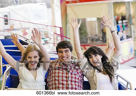 portrait of three teenage friends at merry-go-round View Large Photo Image Stock Image - portrait of three teenage friends at merry-go-round. Fotosearch