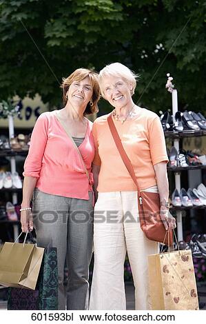 portrait of two senior women with shopping bags View Large Photo Image Stock Image - portrait of two senior women with shopping bags. Fotosearch