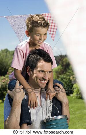 portrait of young on his father´s shoulders View Large Photo Image Stock Image - portrait of young on his father´s shoulders. Fotosearch