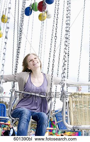portrait of young woman sitting in chairoplane View Large Photo Image Stock Image - portrait of young woman sitting in chairoplane. Fotosearch