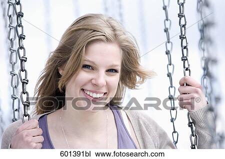 portrait of young woman sitting in chairoplane View Large Photo Image Stock Image - portrait of young woman sitting in chairoplane. Fotosearch