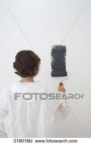 rear view of woman painting wall blue with paint roller View Large Photo Image Stock Image - rear view of woman painting wall blue with paint roller. Fotosearch
