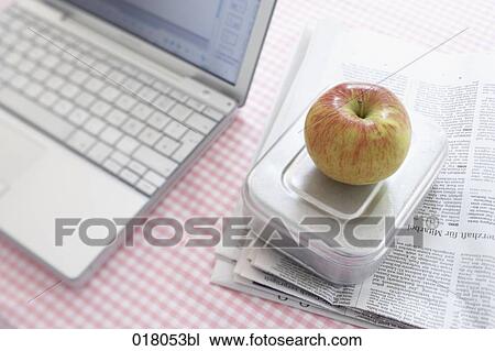still life of apple on lunchbox beside computer View Large Photo Image Stock Image - still life of apple on lunchbox beside computer. Fotosearch