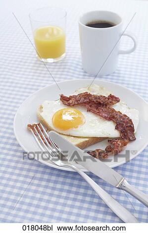 still life of breakfast consiting of fried egg and bacon View Large Photo Image Stock Image - still life of breakfast consiting of fried egg and bacon. Fotosearch
