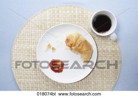 Stock Image - still life of breakfast with croissant and coffee. Fotosearch