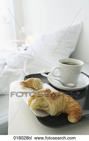 still life of croissant and coffee beside bed View Large Photo Image Stock Image - still life of croissant and coffee beside bed. Fotosearch