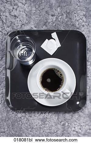 still life of cup of coffee glass of water and tablet View Large Photo Image Stock Image - still life of cup of coffee glass of water and tablet. Fotosearch