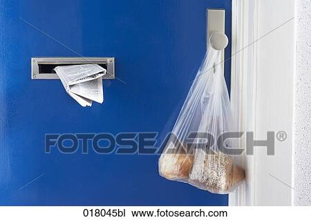 still life of door with newspaper in letter slot and bag with pastries hanging on door knob View Large Photo Image Stock Image - still life of door with newspaper in letter slot and bag with pastries hanging on door knob. Fotosearch