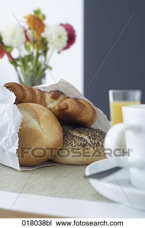 still life of fresh pastries in paper bag on breakfast table View Large Photo Image Stock Image - still life of fresh pastries in paper bag on breakfast table. Fotosearch
