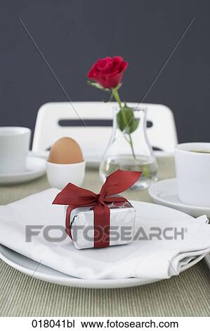 still life of gift box on plate at breakfast table View Large Photo Image Stock Image - still life of gift box on plate at breakfast table. Fotosearch