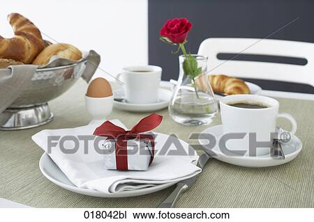 still life of gift box on plate at breakfast table View Large Photo Image Stock Image - still life of gift box on plate at breakfast table. Fotosearch
