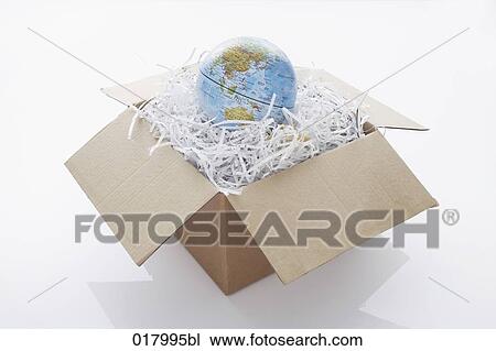 still life of globe coming out of cardboard box View Large Photo Image Stock Image - still life of globe coming out of cardboard box. Fotosearch