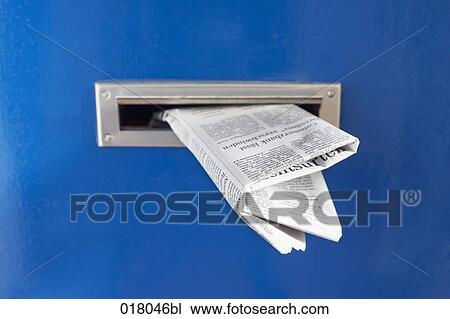 still life of newspaper in letter slot of door View Large Photo Image Stock Image - still life of newspaper in letter slot of door. Fotosearch