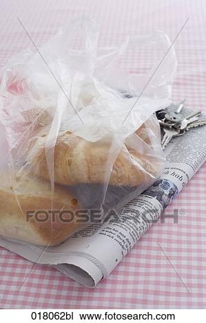 still life of plastic bag with pastries newspaper and keys View Large Photo Image Stock Image - still life of plastic bag with pastries newspaper and keys. Fotosearch
