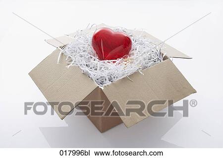 still life of red heart coming out of cardboard box View Large Photo Image Stock Image - still life of red heart coming out of cardboard box. Fotosearch