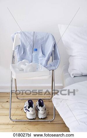 still life of sport equipment on chair beside bed View Large Photo Image Stock Image - still life of sport equipment on chair beside bed. Fotosearch