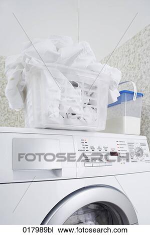 still life of white laundry in basket standing washing machine View Large Photo Image Stock Image - still life of white laundry in basket standing washing machine. Fotosearch