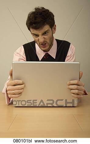 angry businessman having problem with his laptop computer View Large Photo Image Stock Image - angry businessman having problem with his laptop computer. Fotosearch