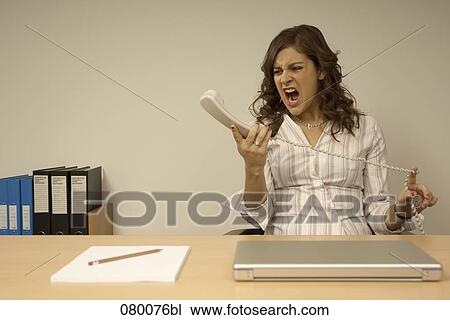 angry secretary shouting at her telephone View Large Photo Image Stock Image - angry secretary shouting at her telephone. Fotosearch