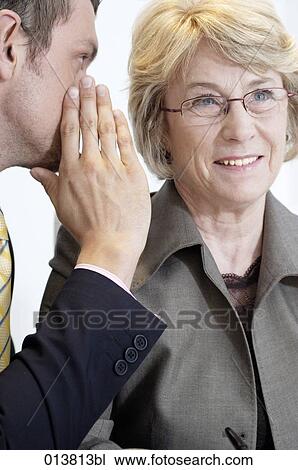 boss curiously listening to executive whispering View Large Photo Image Stock Image - boss curiously listening to executive whispering. Fotosearch