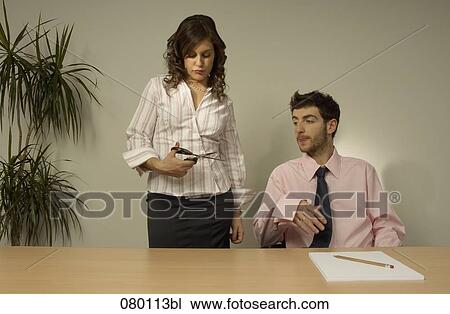 businessman and businesswoman in office woman holding scissors View Large Photo Image Stock Image - businessman and businesswoman in office woman holding scissors. Fotosearch