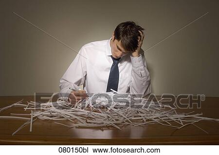 businessman having pile of shredded paper on his desk View Large Photo Image Stock Image - businessman having pile of shredded paper on his desk. Fotosearch
