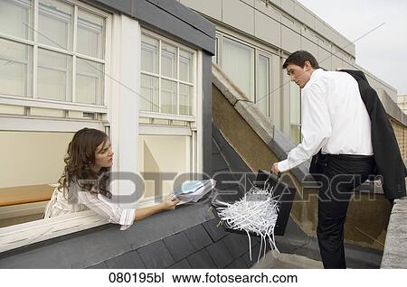 businessman leaving escaping from meeting room female colleague trying to give him file View Large Photo Image Stock Image - businessman leaving escaping from meeting room female colleague trying to give him file. Fotosearch