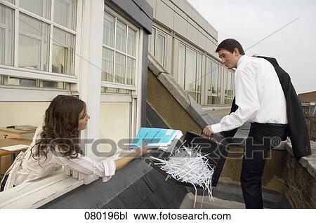 businessman leaving escaping from meeting room female colleague trying to give him file View Large Photo Image Stock Image - businessman leaving escaping from meeting room female colleague trying to give him file. Fotosearch