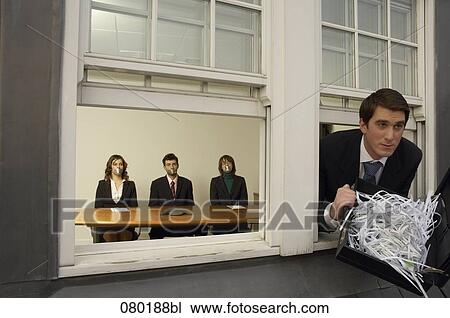 businessman leaving office building through window with briefcase full of shredded paper View Large Photo Image Stock Image - businessman leaving office building through window with briefcase full of shredded paper. Fotosearch