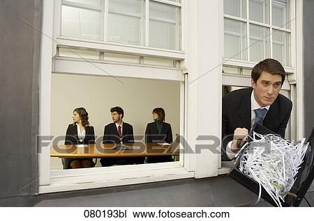 businessman leaving office building through window with briefcase full of shredded paper View Large Photo Image Stock Image - businessman leaving office building through window with briefcase full of shredded paper. Fotosearch