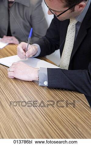 businessman making notes during meeting View Large Photo Image Stock Image - businessman making notes during meeting. Fotosearch