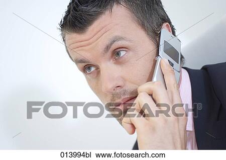 businessman with thoughtful expression listening to mobile View Large Photo Image Stock Image - businessman with thoughtful expression listening to mobile. Fotosearch