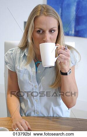 businesswoman taking a coffee break in conference room View Large Photo Image Stock Image - businesswoman taking a coffee break in conference room. Fotosearch