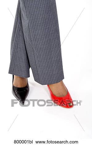 businesswoman wearing two different shoes View Large Photo Image Stock Image - businesswoman wearing two different shoes. Fotosearch