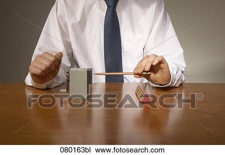 close-up of businessman at desk using pencil sharpener View Large Photo Image Stock Image - close-up of businessman at desk using pencil sharpener. Fotosearch