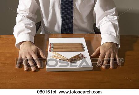 close-up of businessman at desk with pencils and documents View Large Photo Image Stock Image - close-up of businessman at desk with pencils and documents. Fotosearch