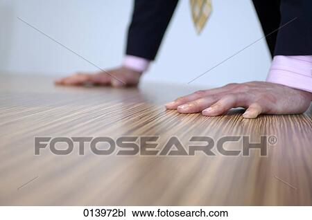 close-up of businessman leaning on table View Large Photo Image Stock Image - close-up of businessman leaning on table. Fotosearch