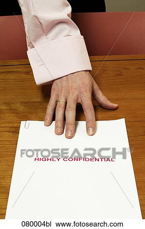 close-up of businessman´s hand grabbing for confidential document View Large Photo Image Stock Image - close-up of businessman´s hand grabbing for confidential document. Fotosearch